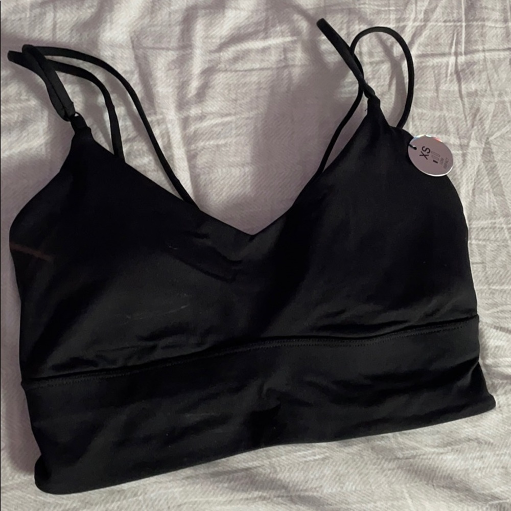 NWT black strappy caged back sports bra